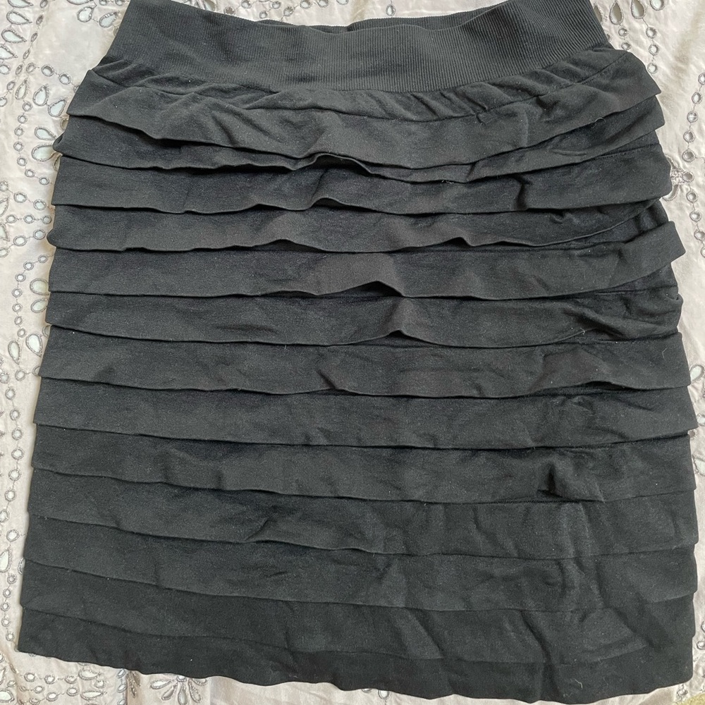 Black right fitting stretch mini skirt. One size